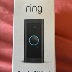 Ring Doorbell Wired in Black and Blue. Brand new.I never used. In original box.